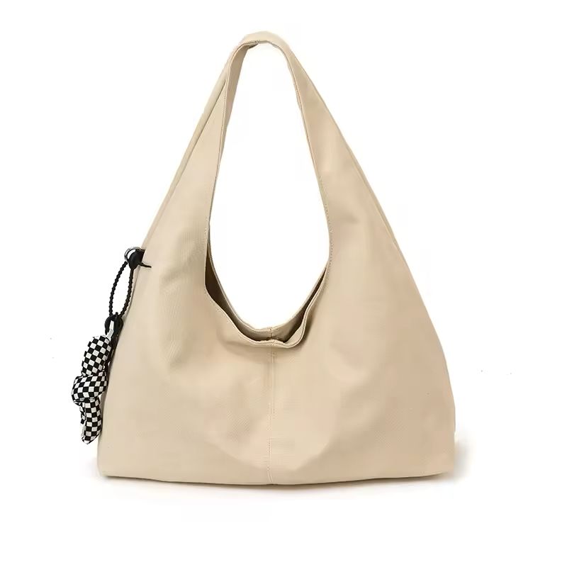 Bolso de hombro con detalle de lazo